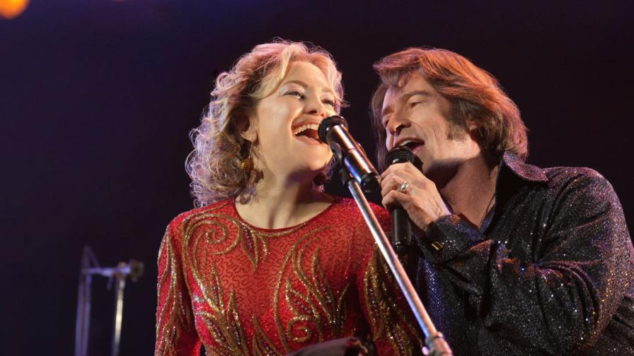 Истинската история на „Song Sung Blue“: Запознайте се с реалната двойка, изиграна от Хю Джакман и Кейт Хъдсън